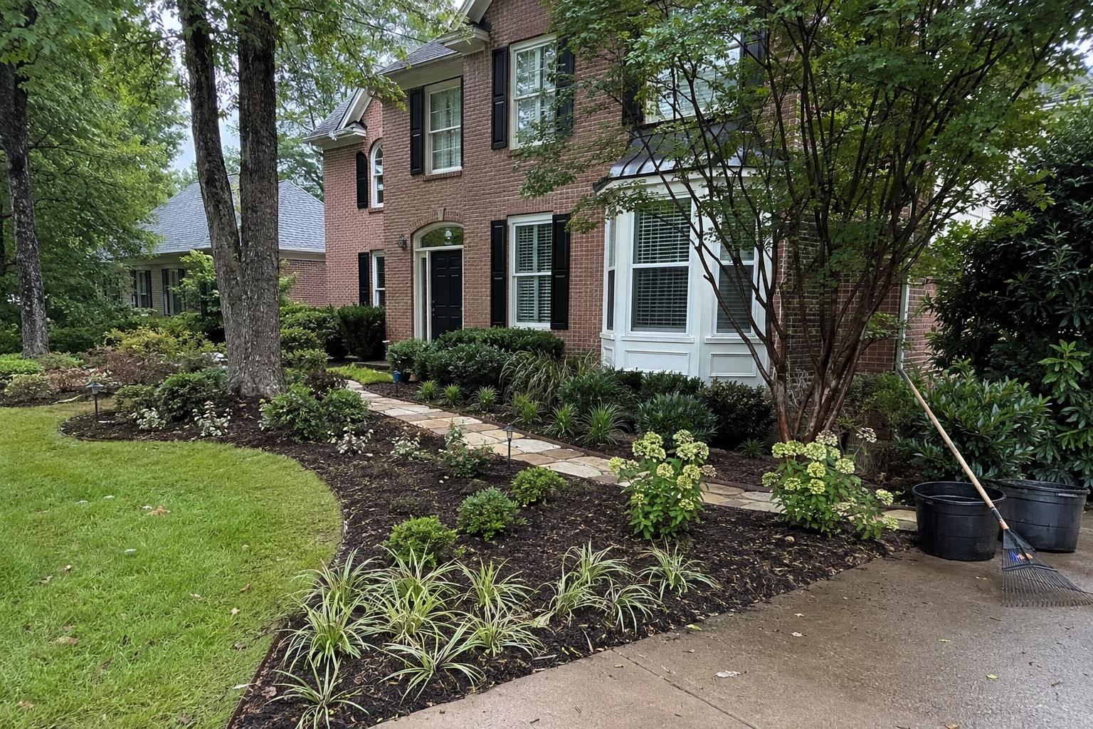 New foundation planting beds being finished at a brick home